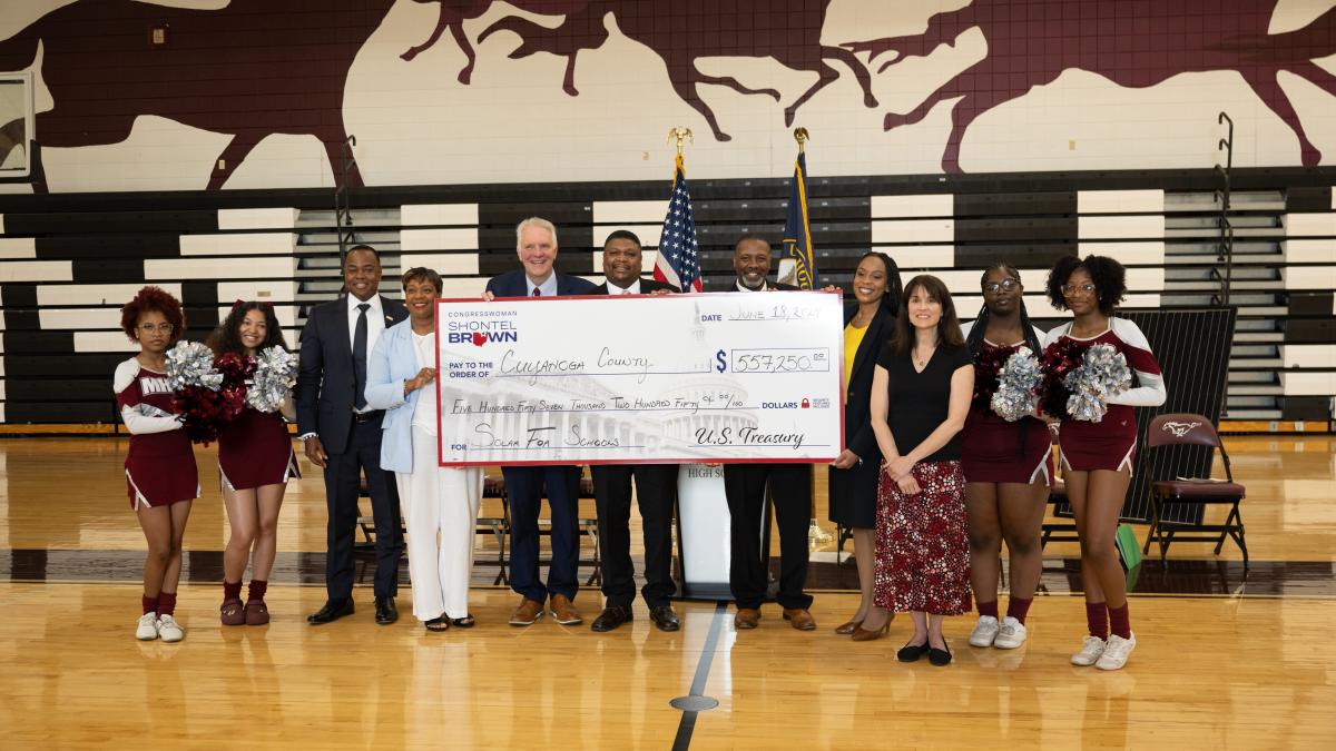 group photo holding check